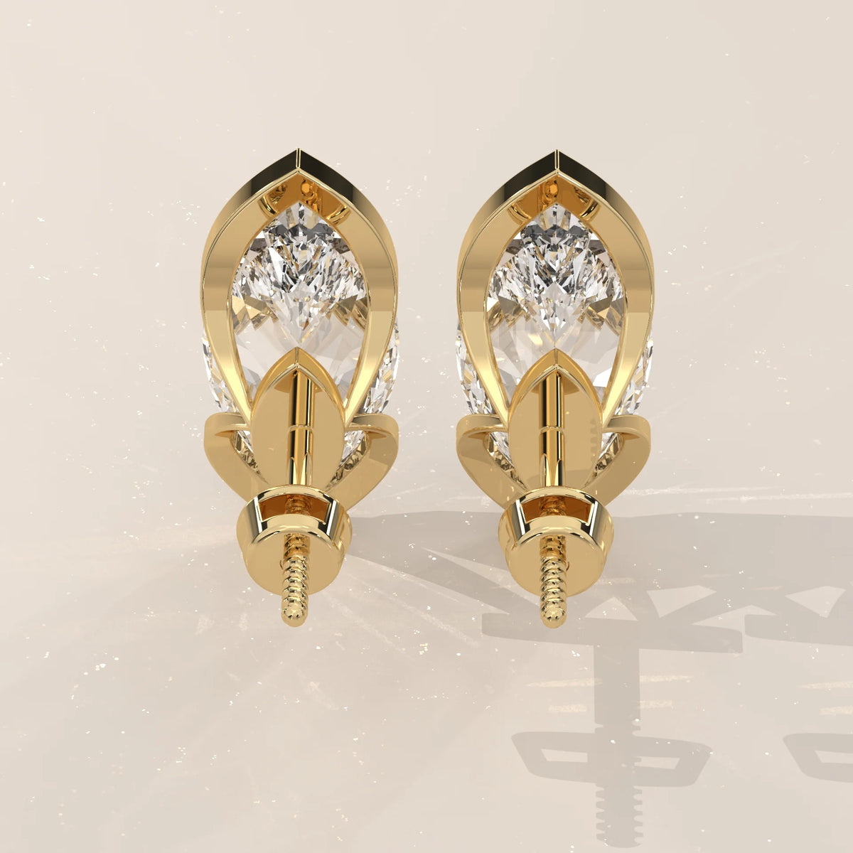 Marquise Lab Grown Diamond Studs with Pointed Tip Bezels in yellow gold, photographed head-on.