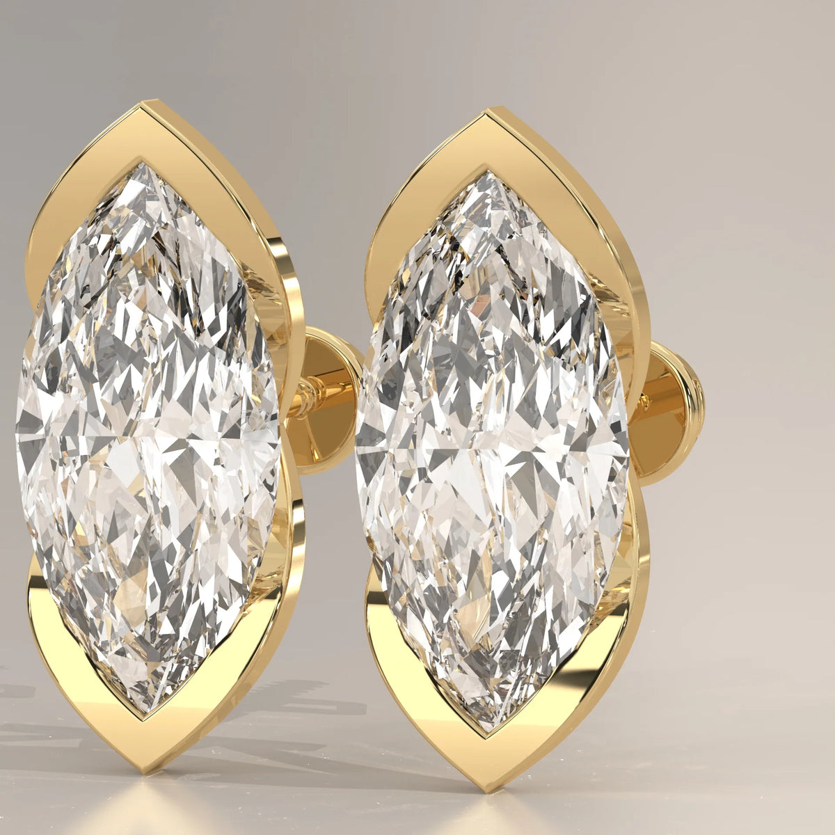 Marquise Lab Grown Diamond Studs with Pointed Tip Bezels in yellow gold, front view on a plain background.