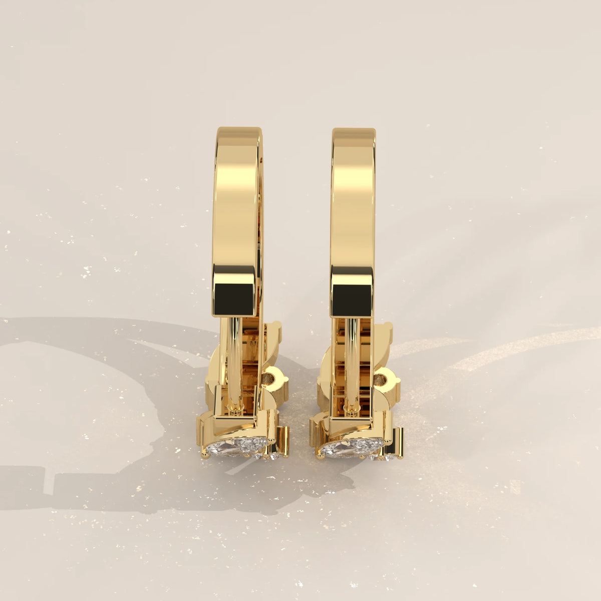 Marquise and Round Lab Grown Diamond Hoops in a Leaf Pattern in yellow gold, product photograph on a plain background.