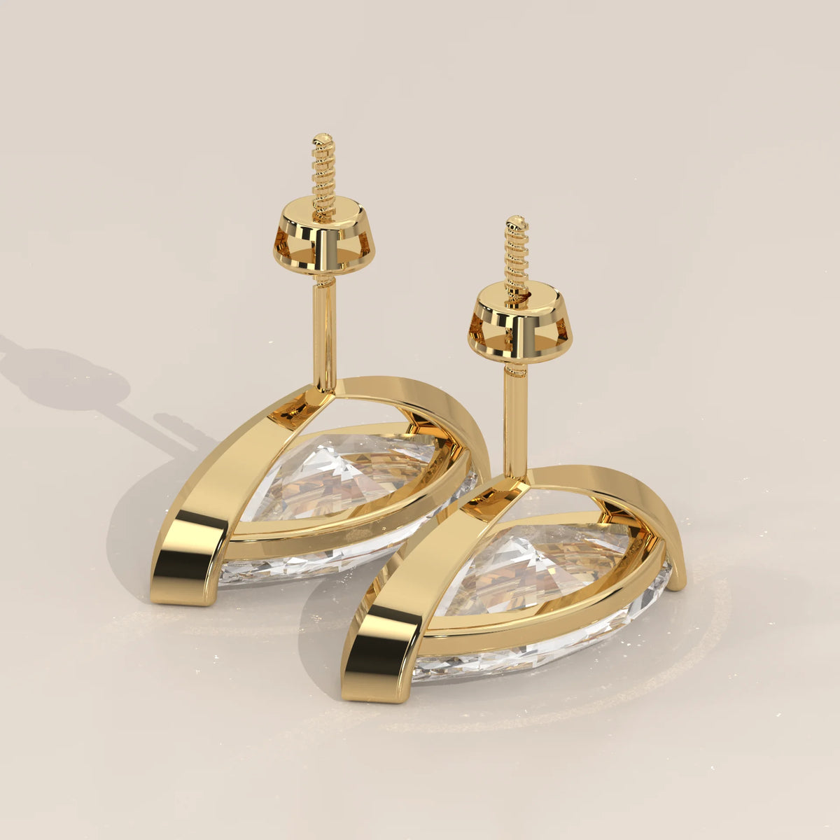 Marquise Solitaire Lab Grown Diamond Studs with V Tip Prongs in yellow gold, shown at an angle.