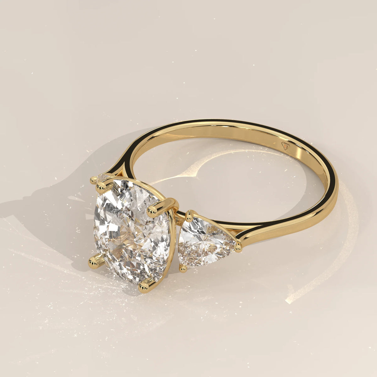 Mennie 5 Carat Cushion Lab Grown Diamond Ring, Trillion Sides in yellow gold, shown from the side.