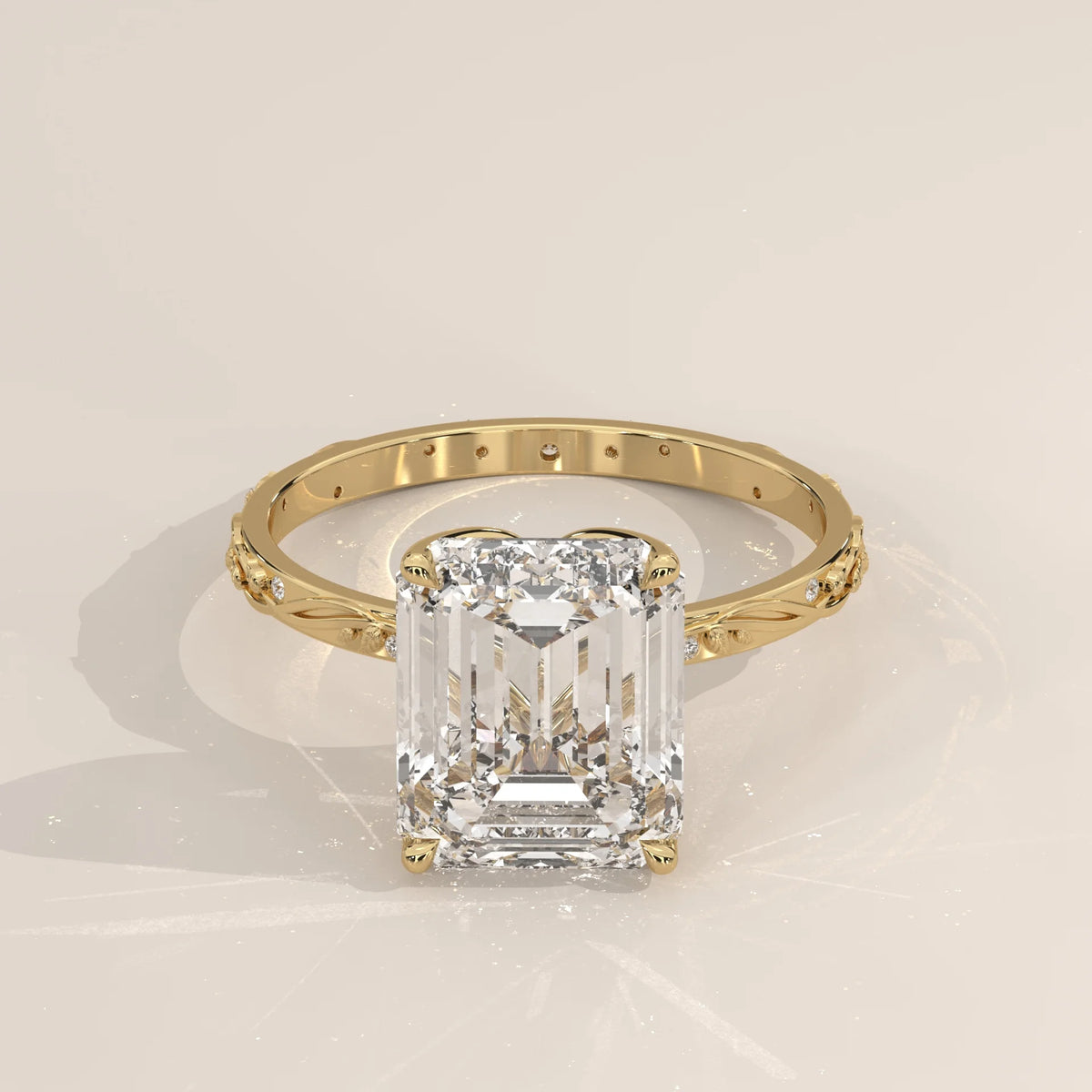 Miloise 5 Carat Emerald Cut Lab Grown Diamond Ring, Engraved Vine in yellow gold, shown at an angle from above.
