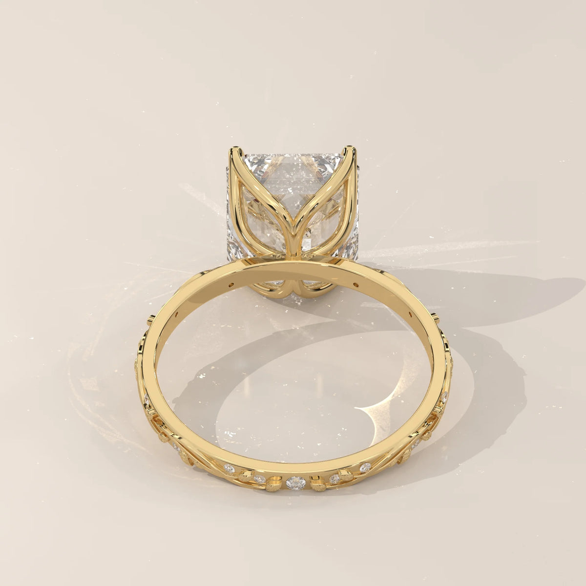 Miloise 5 Carat Emerald Cut Lab Grown Diamond Ring, Engraved Vine in yellow gold, back view of the tulip basket.