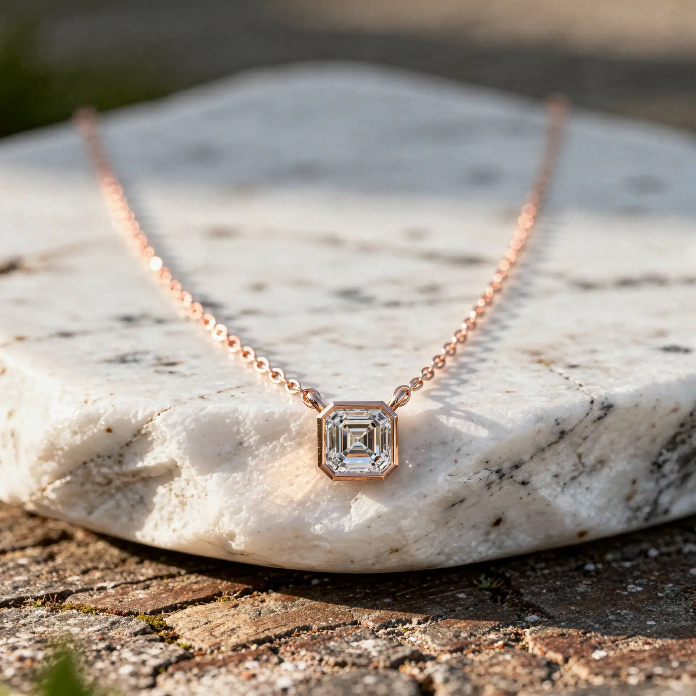 Close-up: Emerald Diamond Necklace with Bezel Setting in 14k Rose Gold - Lab Grown - Driona Jewels