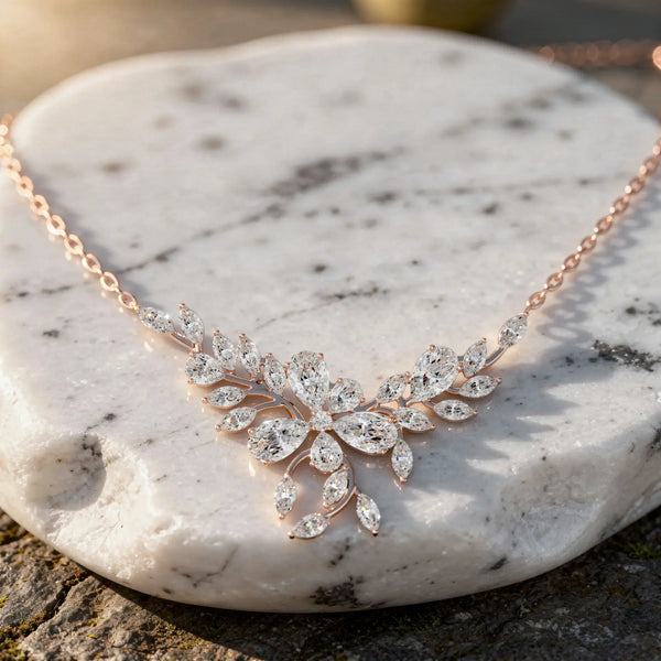 Flat Lay: Marquise Diamond Necklace with Floral Setting in 14k Rose Gold - Lab Grown - Driona Jewels