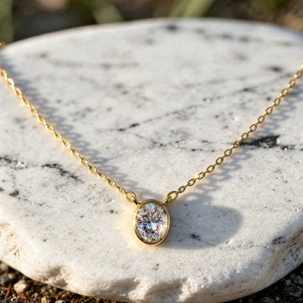 Close-up: Oval Diamond Necklace with Bezel Setting in 14k Yellow Gold - Lab Grown - Driona Jewels