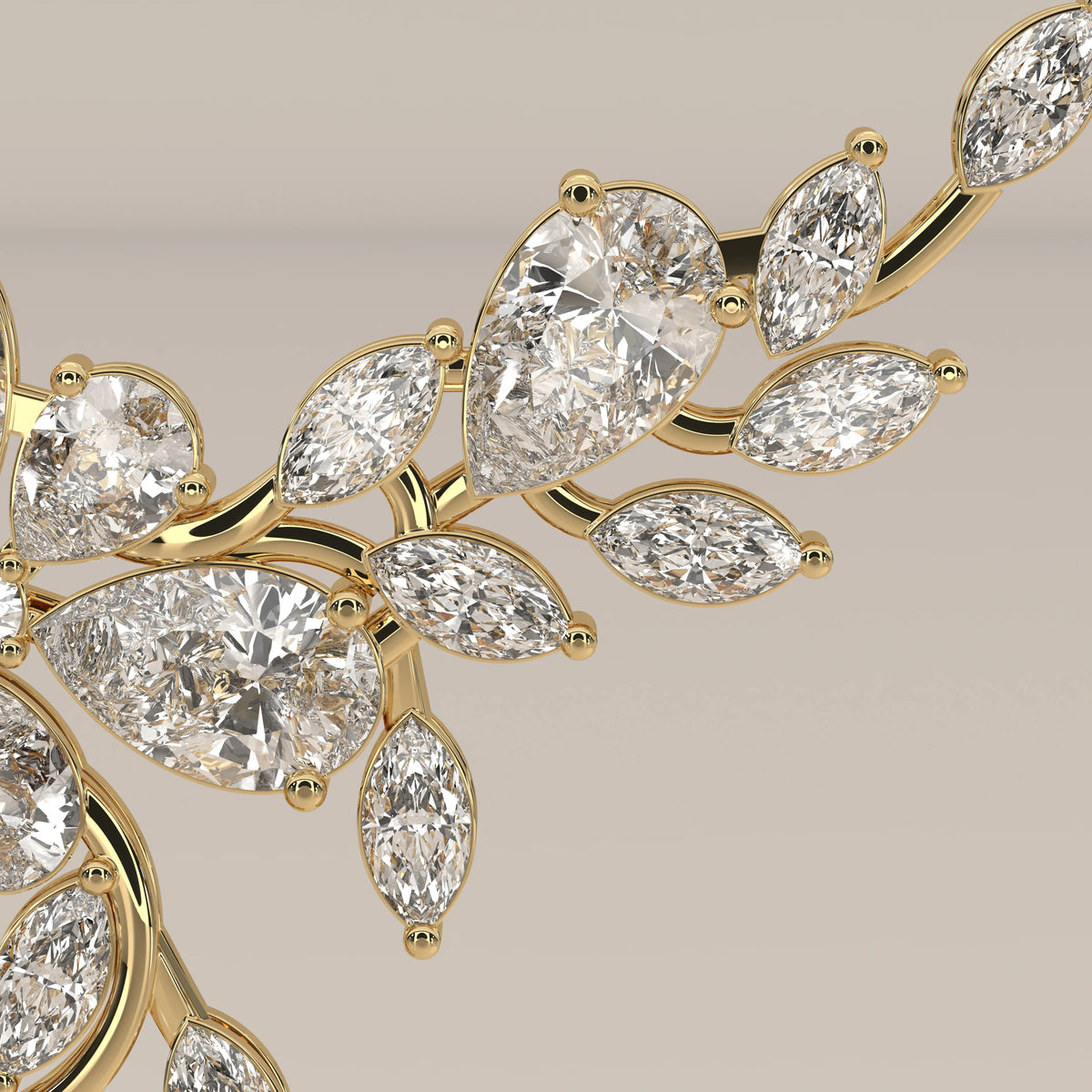 A marquise and pear lab grown diamond leaf necklace in yellow gold, viewed from overhead.