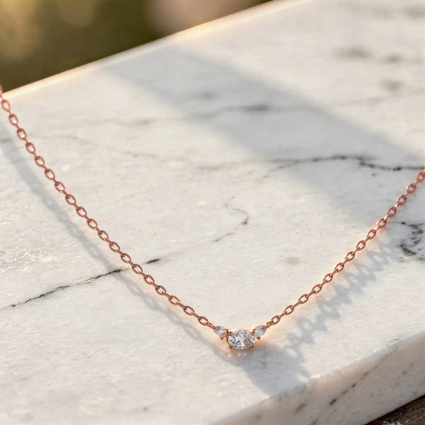 Flat Lay: Round Diamond Necklace with Bezel Setting in 14k Rose Gold - Lab Grown - Driona Jewels