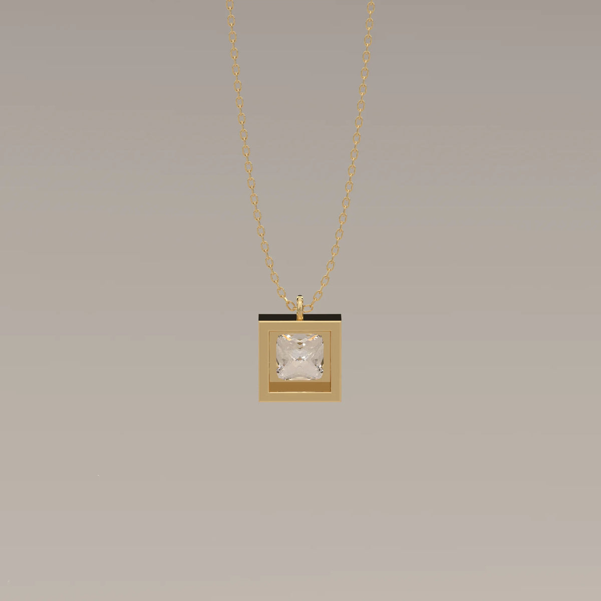 Gold necklace with a square pendant featuring a clear square stone.