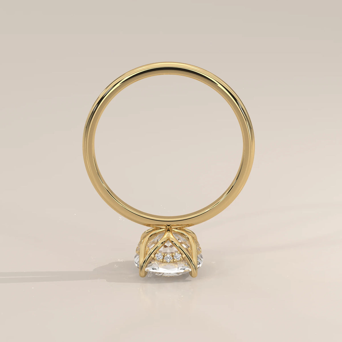 Nemma 5 Carat Cushion Lab Grown Diamond Solitaire, Hidden Halo in yellow gold, photographed from the side.