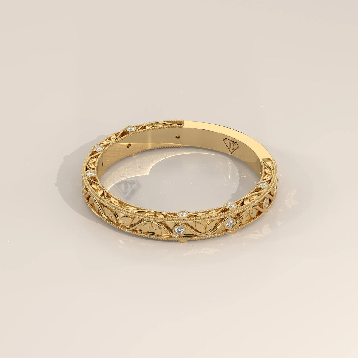 Ornate Filigree Engraved Band with Bezel Set Diamonds in yellow gold, photographed head-on.
