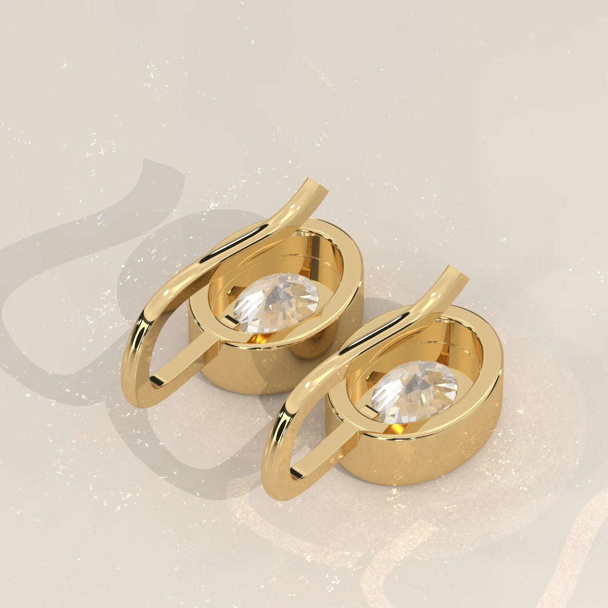 Oval Bezel Set Lab Grown Diamond Drop Earrings on a Gold Hook in yellow gold, shown on a plain background.