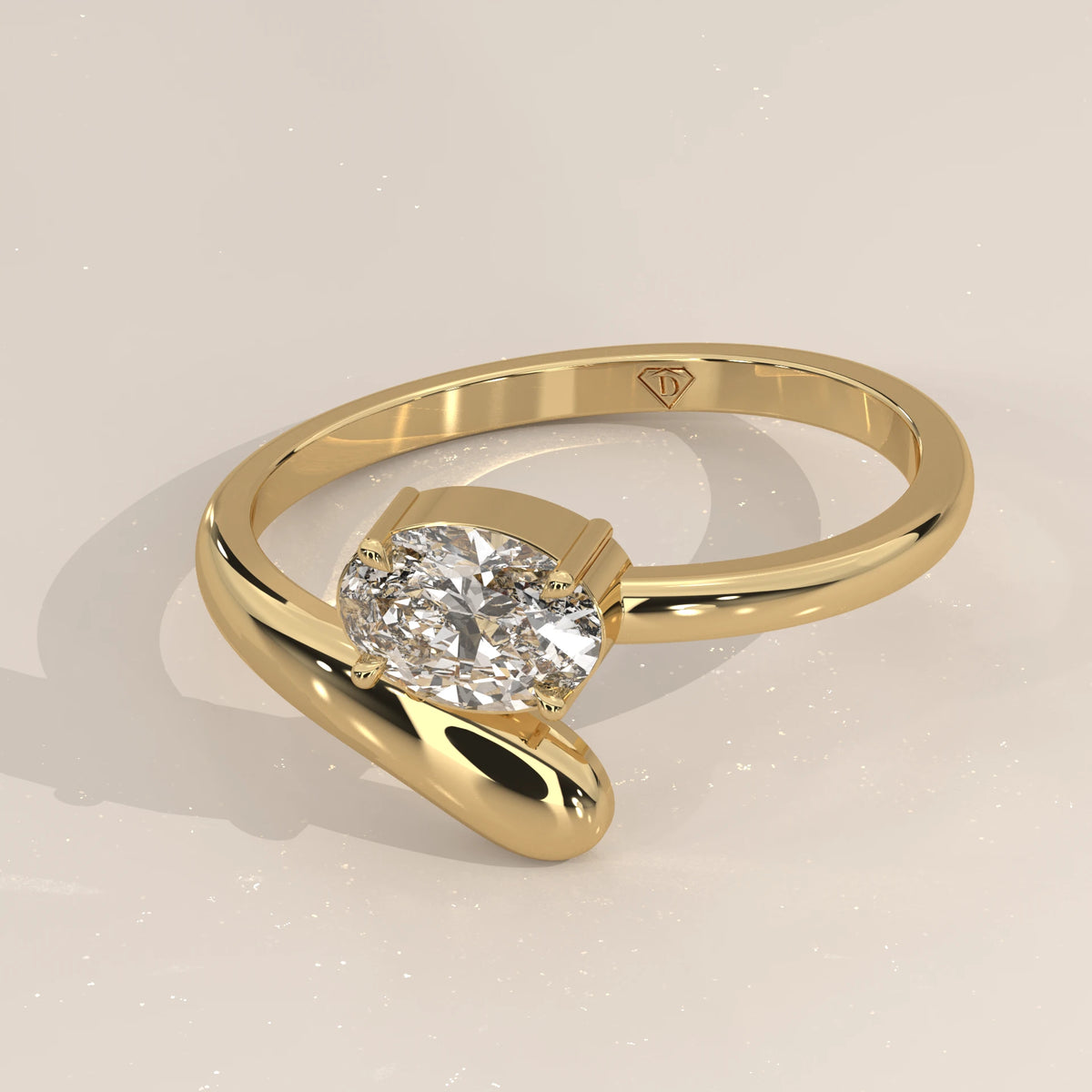 East West Oval Lab Grown Diamond Bypass Ring with Teardrop End in yellow gold, photographed at a three-quarter angle.