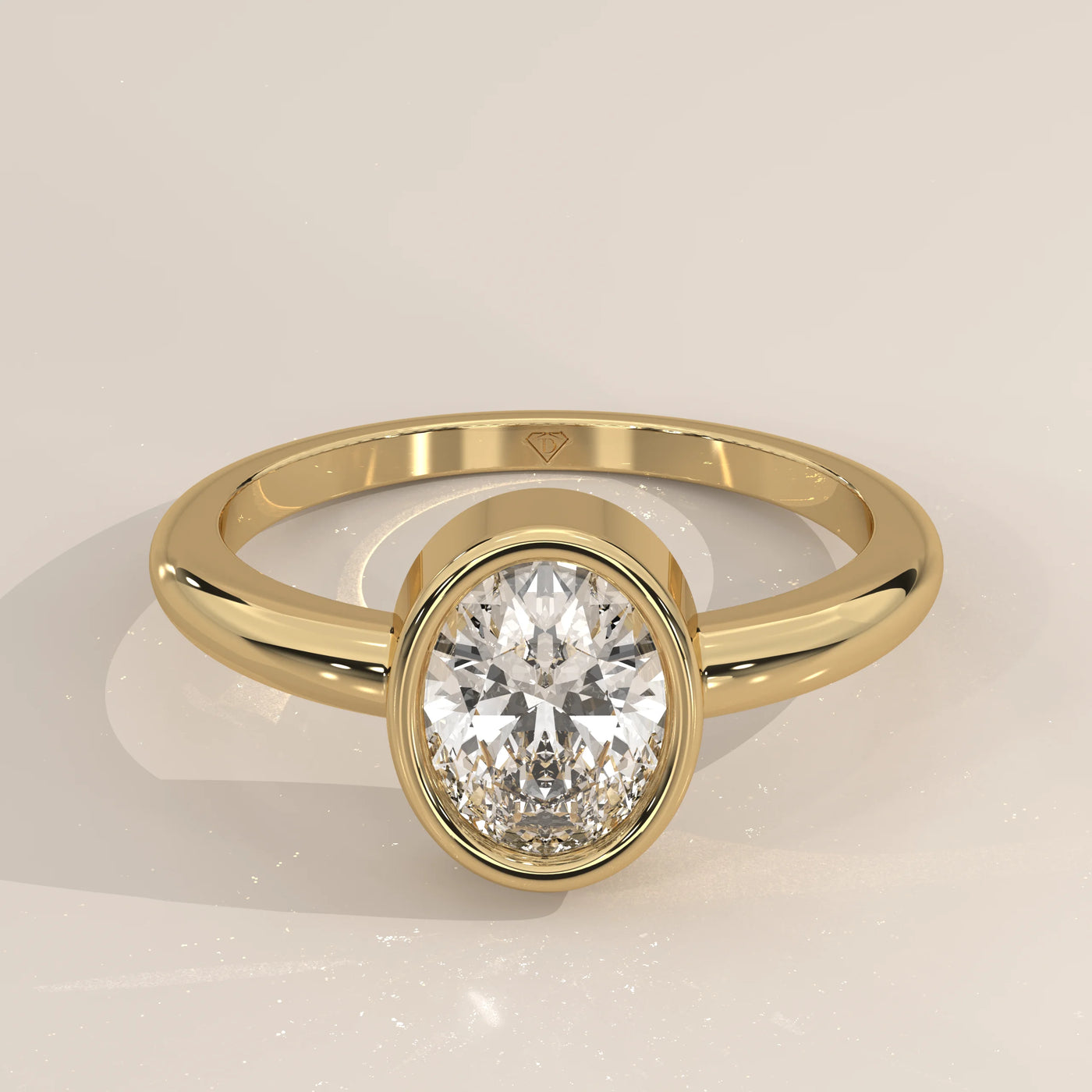Oval cut diamond engagement ring with a paved band in yellow gold.