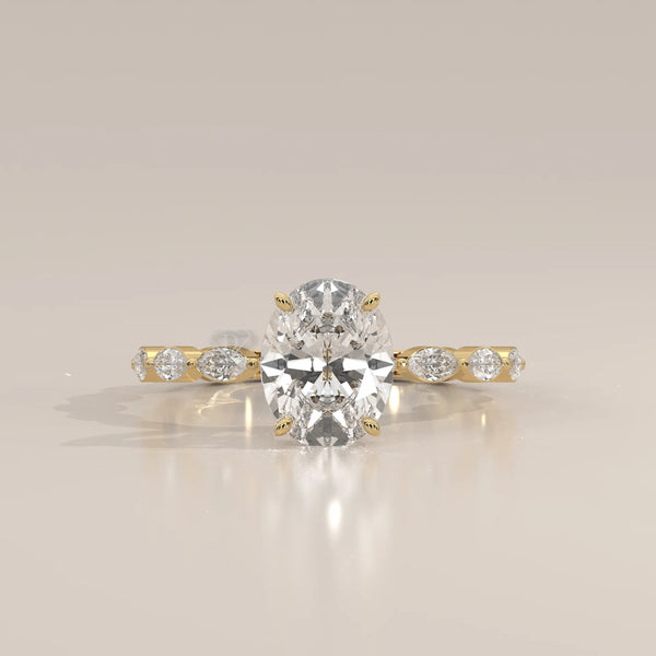 Oval cut diamond engagement ring with accent stones in 14k gold.