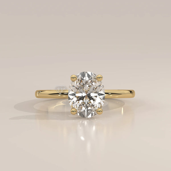 Oval cut diamond engagement ring with accent stones in 14k gold.