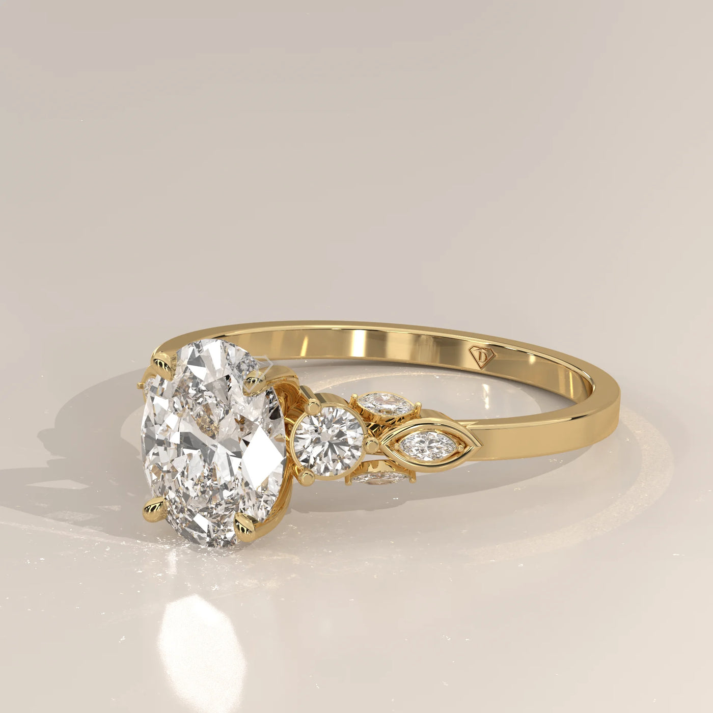 Oval diamond engagement ring with detailed band in yellow gold.