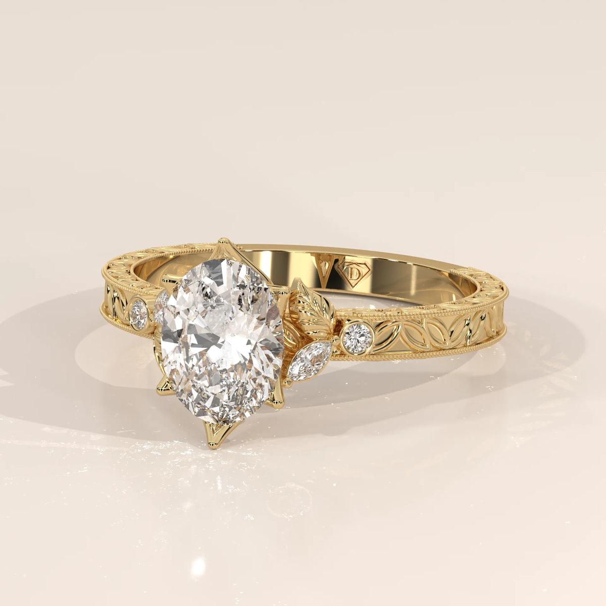 Oval diamond engagement ring with intricate floral details on a gold band.