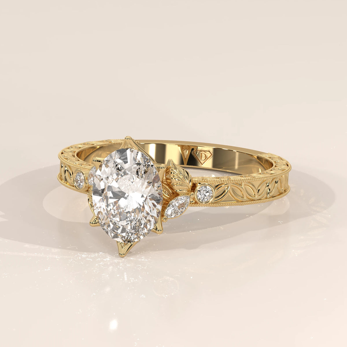 Oval diamond engagement ring with intricate floral details on a gold band.