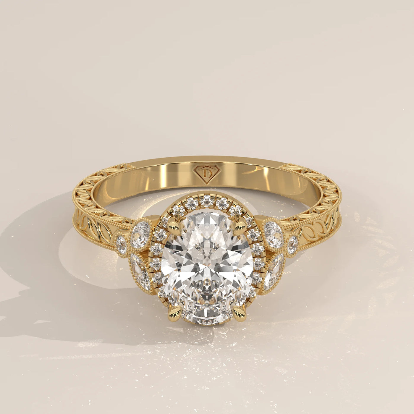 Oval diamond engagement ring with a halo of smaller diamonds in yellow gold.