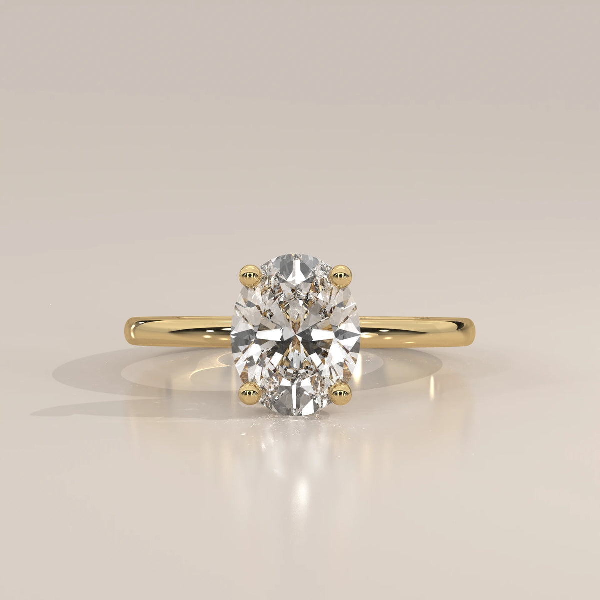 Oval Lab Grown Diamond Solitaire with Hidden Halo and Scroll Gallery in yellow gold, photographed head-on.
