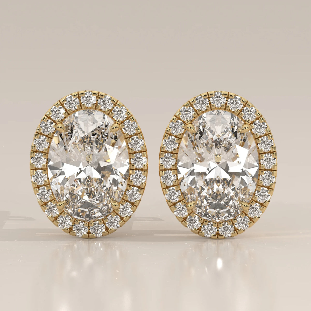 Oval Halo Lab Grown Diamond Stud Earrings with Screw Backs in yellow gold, shown from the front.