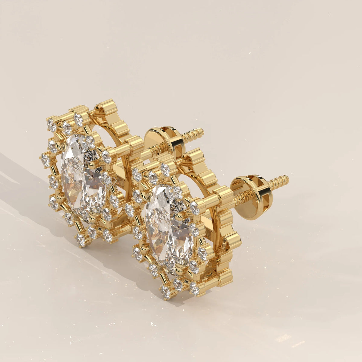 Oval Lab Grown Diamond Studs in a Snowflake Point Halo in yellow gold, shown at an angle.