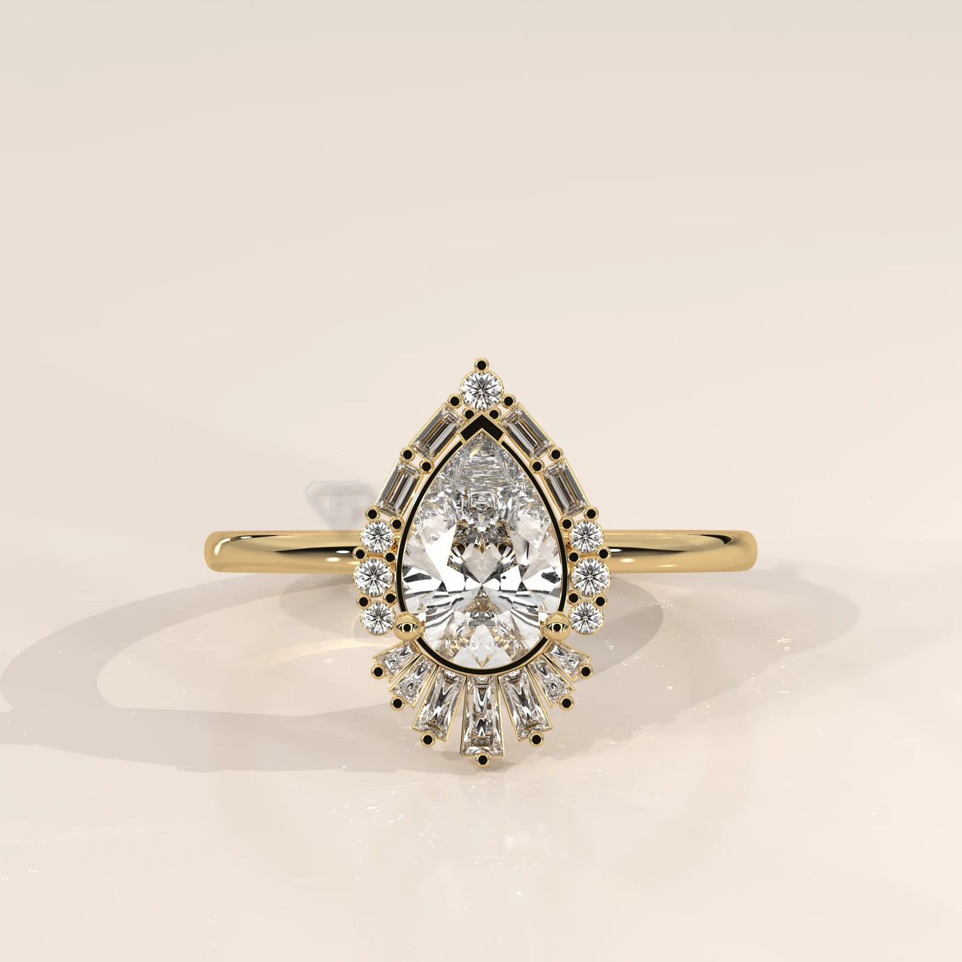 Yellow gold ring with a pear-cut diamond surrounded by smaller diamonds and baguette stones.