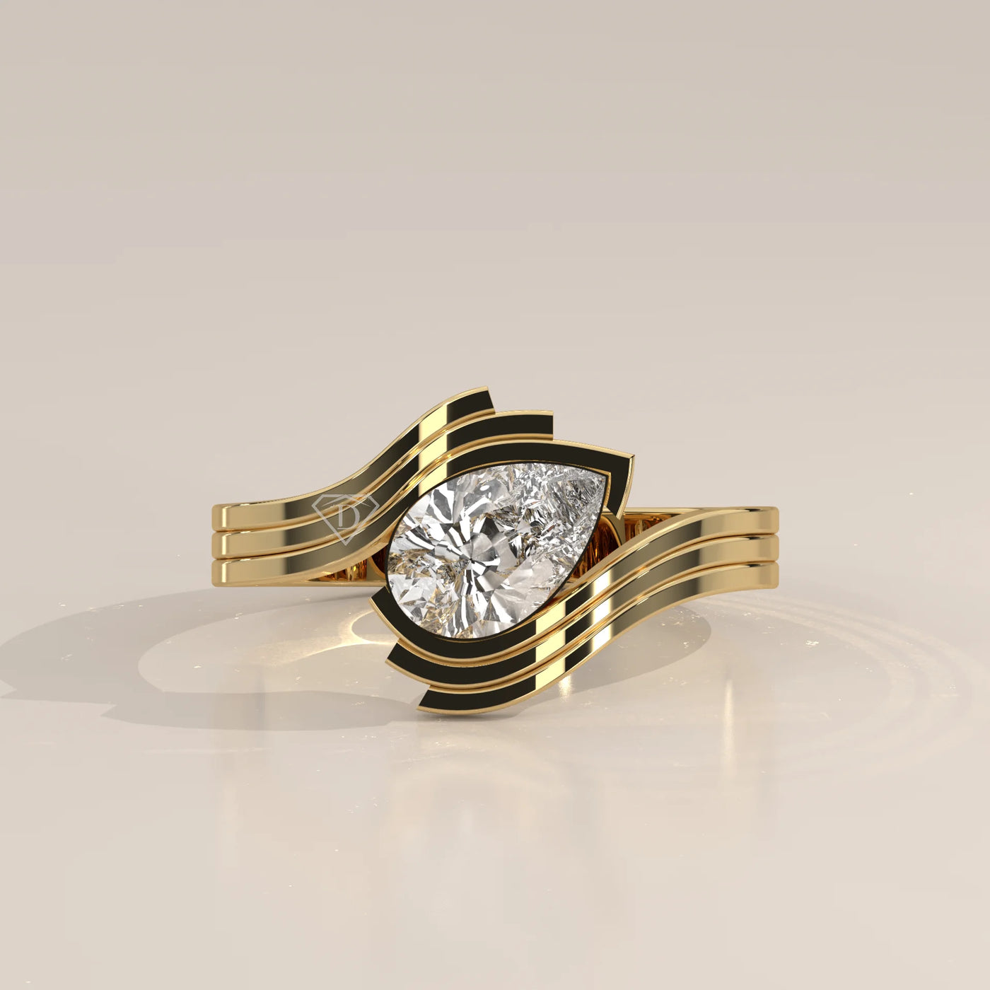 A stunning yellow gold ring with a pear-cut diamond and black accents.