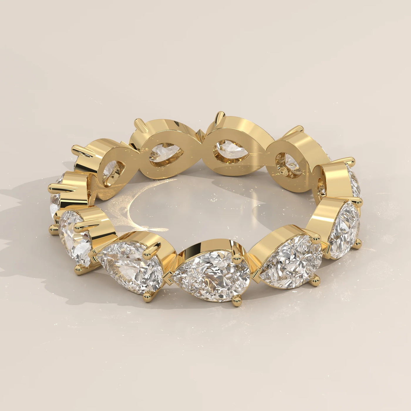Three-Quarter View: Pear Diamond Eternity Band with Eternity Setting in Yellow Gold – Lab Grown – Driona Jewels