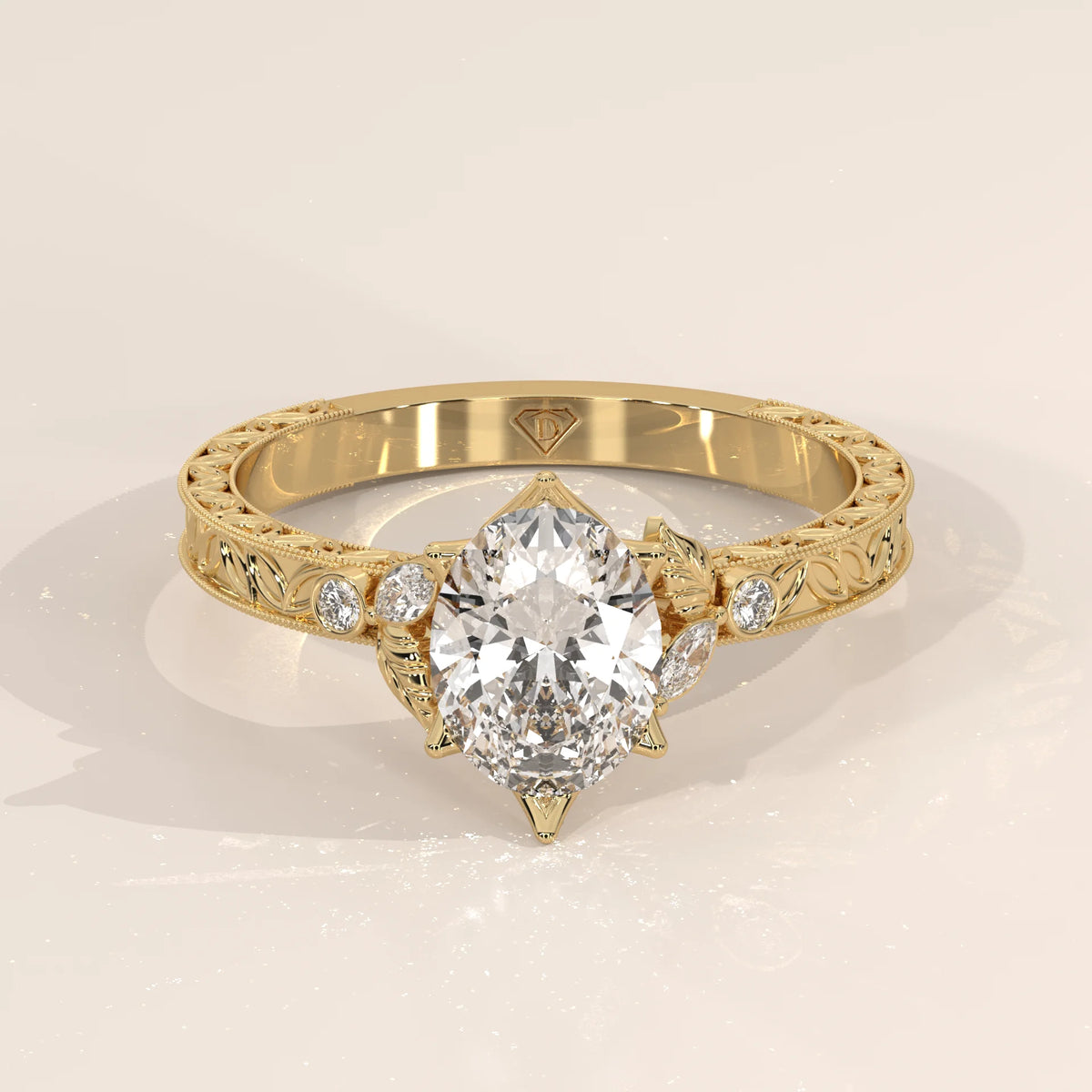 Elegant 14k gold ring with a pear-shaped diamond and intricate band design.