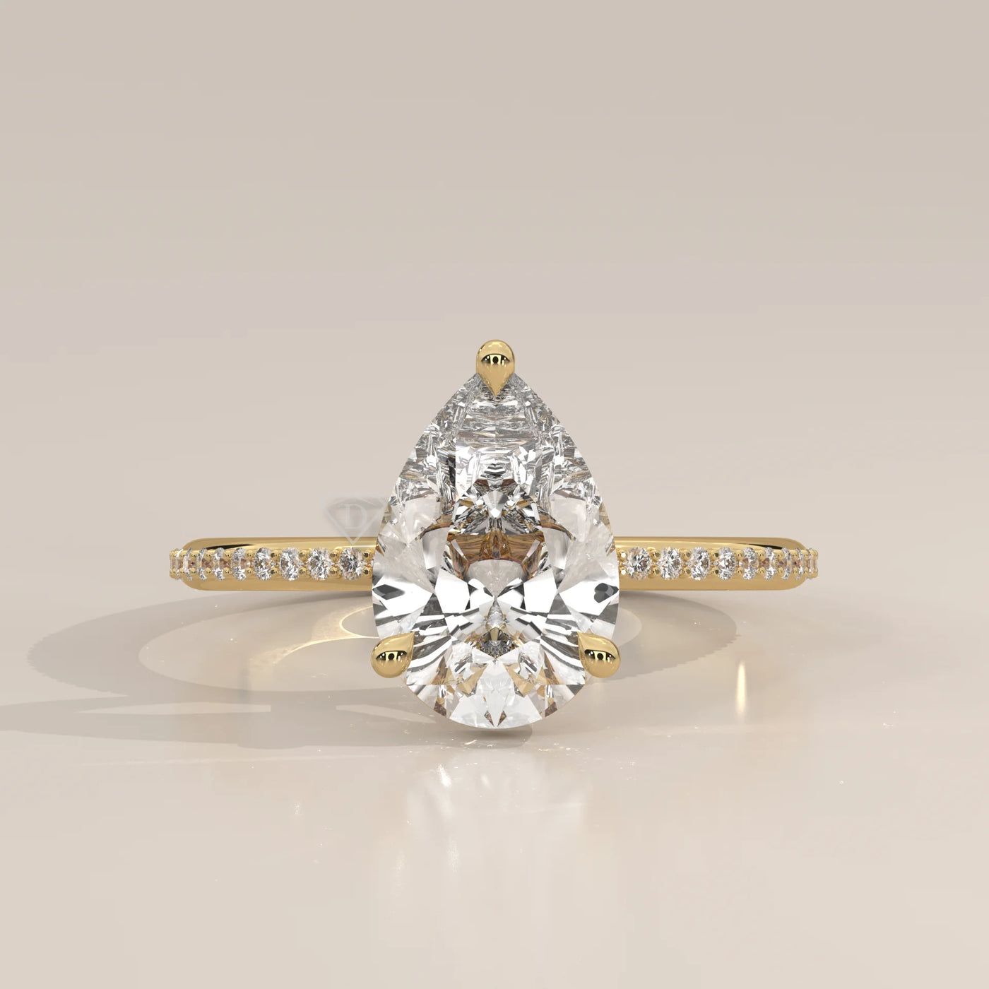 A dazzling pear-shaped diamond engagement ring set in 14k gold.