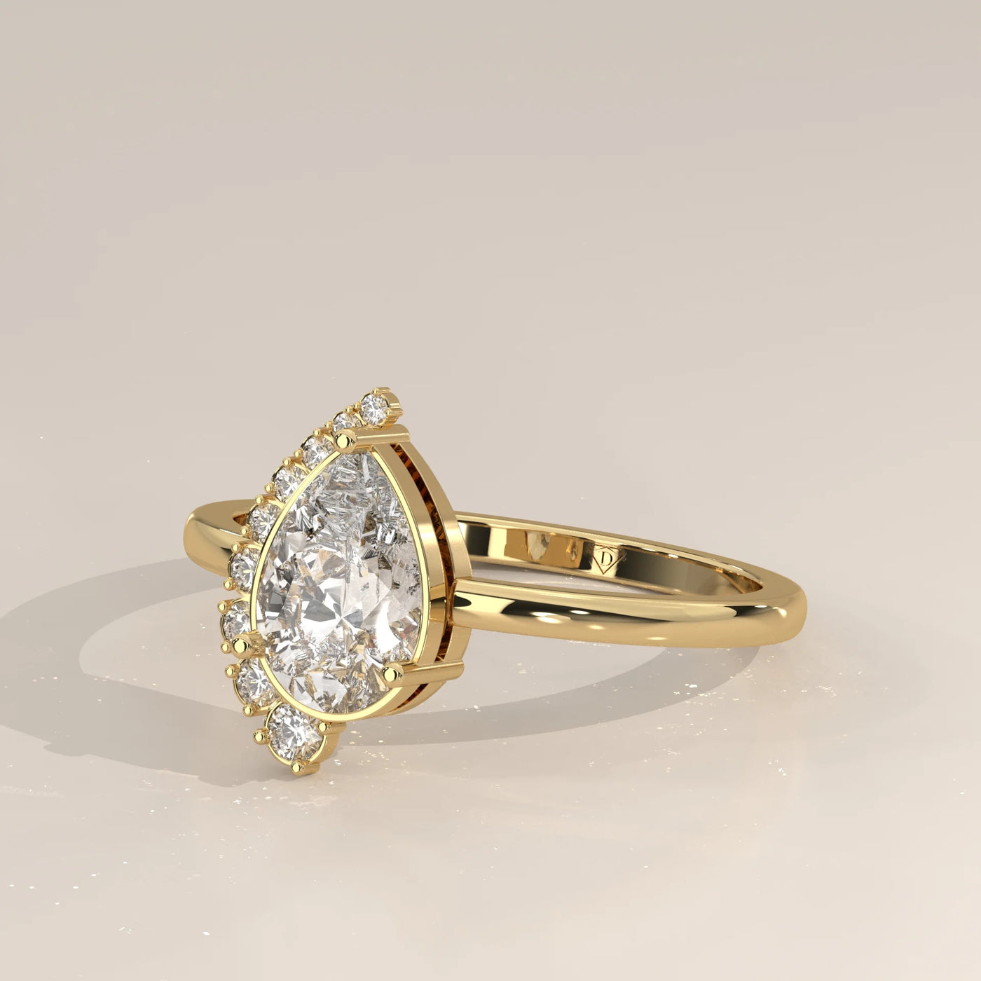 Gold ring with a pear-shaped diamond and accent stones
