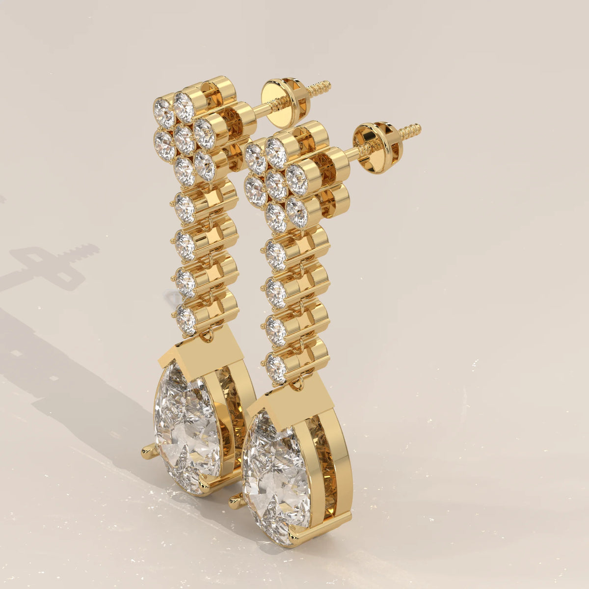 Pear Drop Lab Grown Diamond Earrings with Flower Cluster Top in yellow gold, shown from the side.