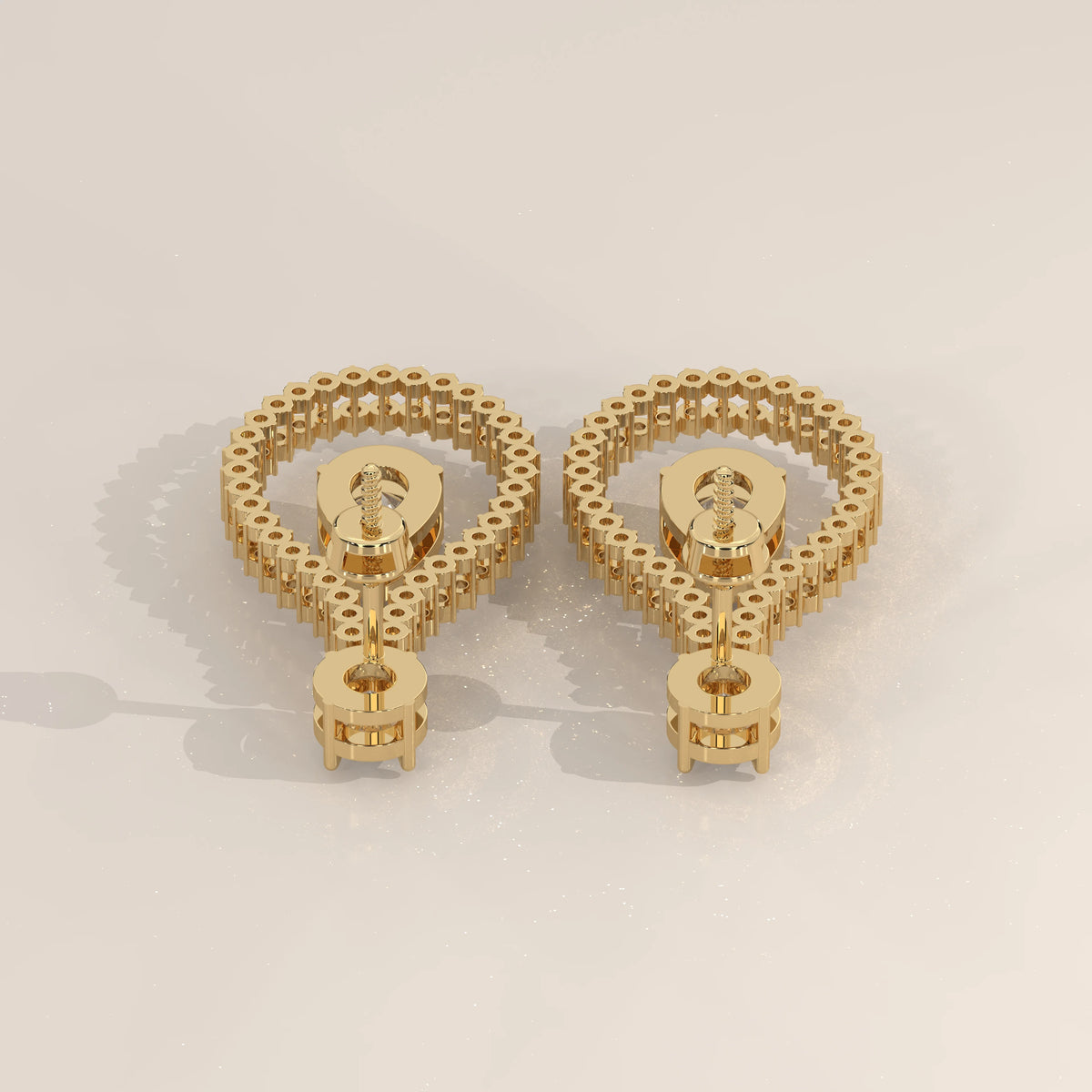 Pear Drop Lab Grown Diamond Earrings in an Open Teardrop Frame in yellow gold, photographed at a three-quarter angle.