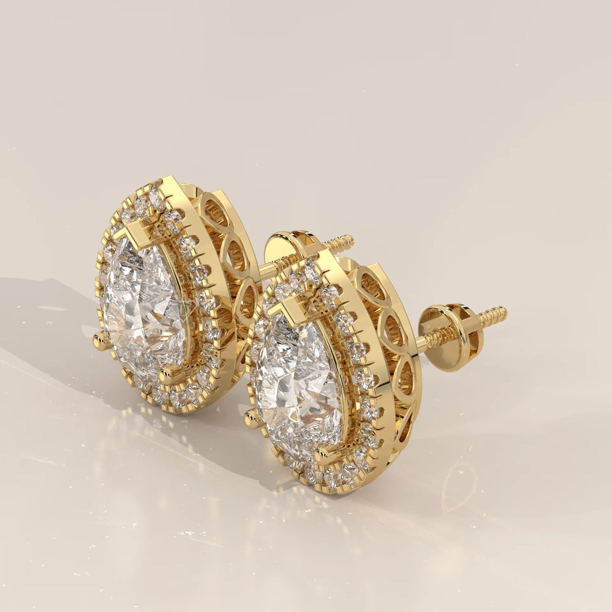 Pear Halo Lab Grown Diamond Studs with Teardrop Cut Out Gallery in yellow gold, shown from the side.