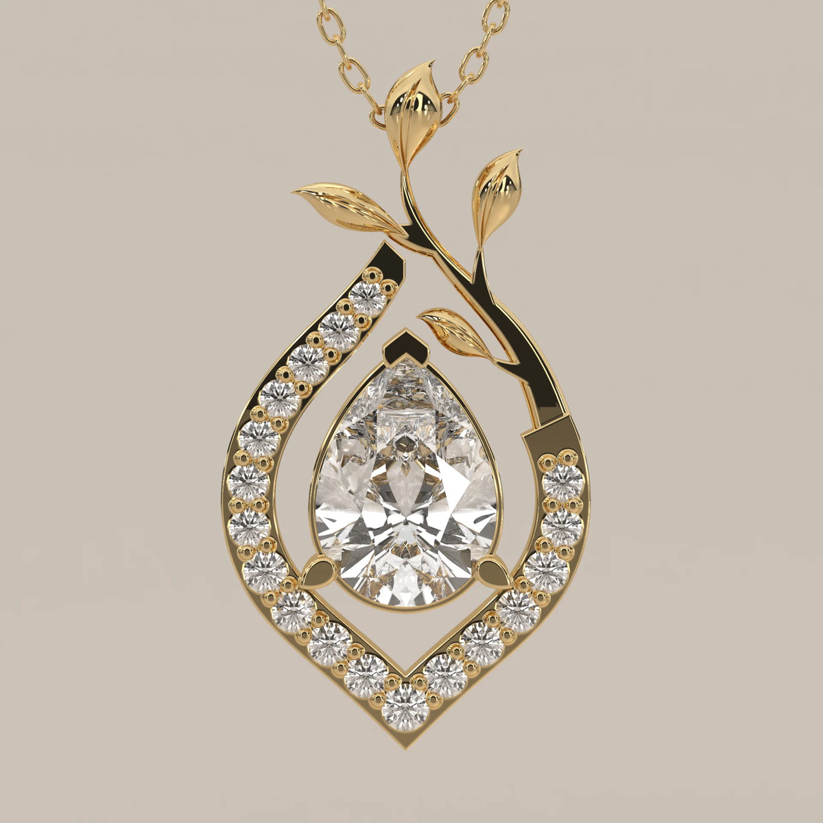 Pear Lab Grown Diamond Pendant in a Pave Teardrop with Leaf Vine in yellow gold, shown on a plain background.