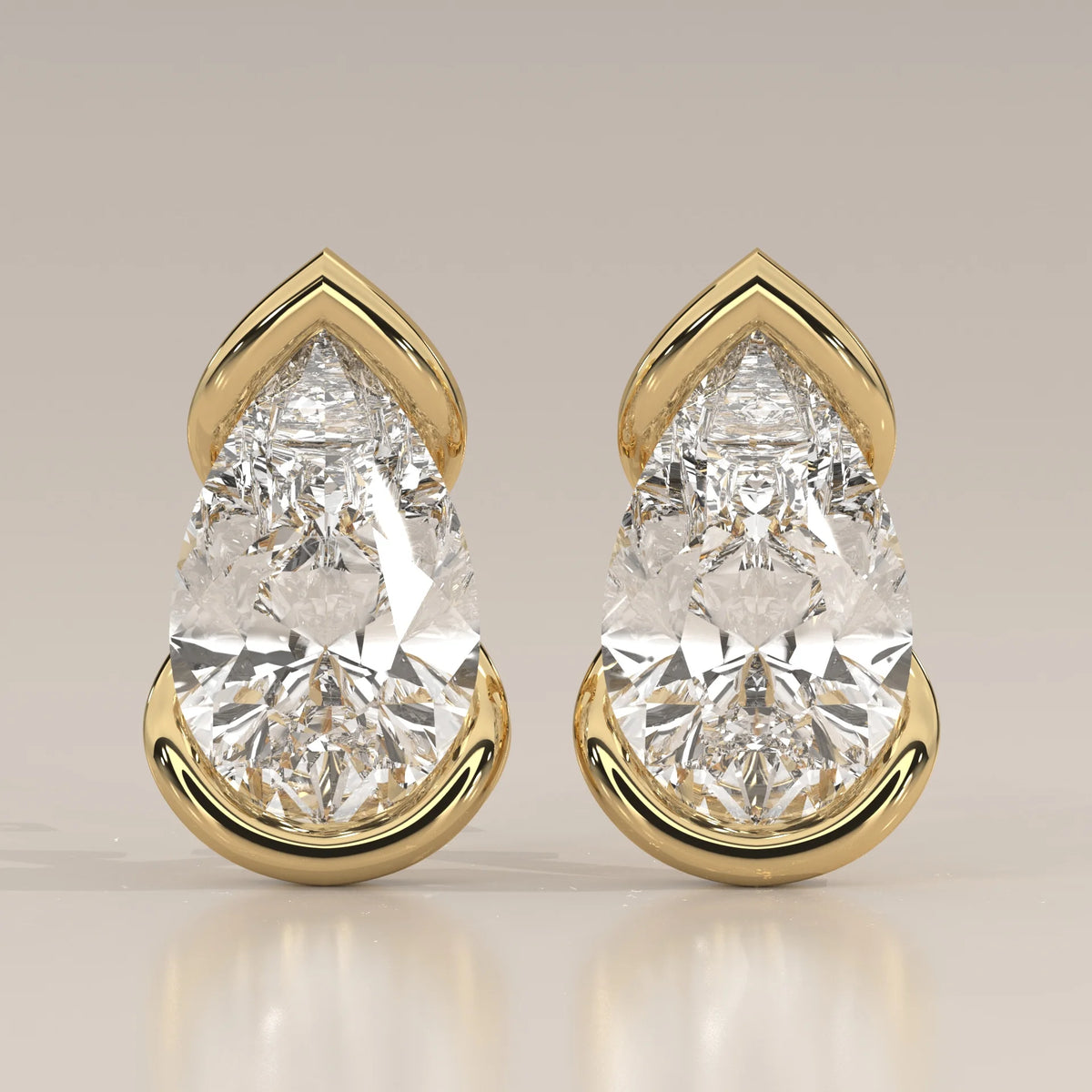 Pear Lab Grown Diamond Studs in a Curving Open Bezel in yellow gold, shown from the front.
