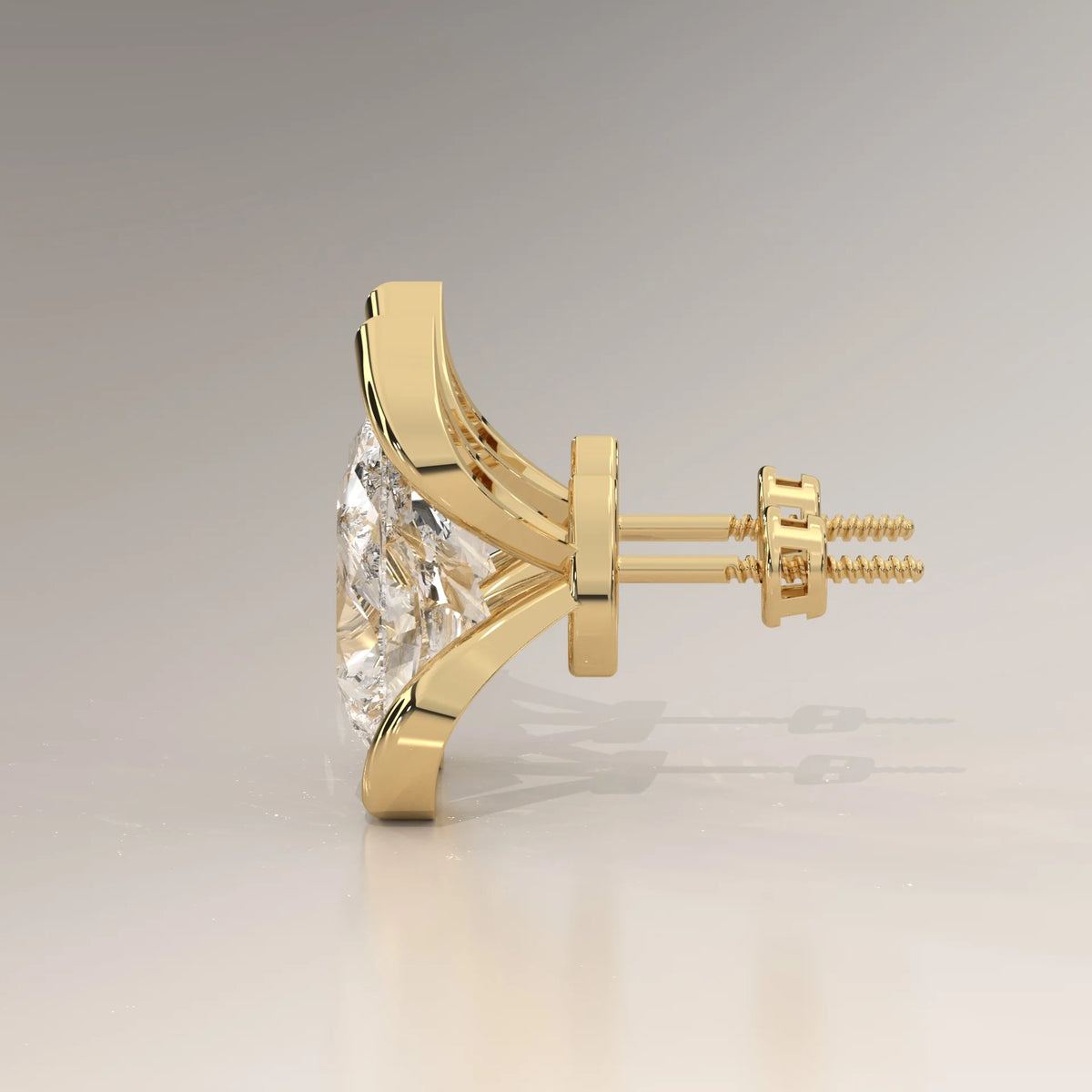 Pear Lab Grown Diamond Studs in a Curving Open Bezel in yellow gold, shown from the side.