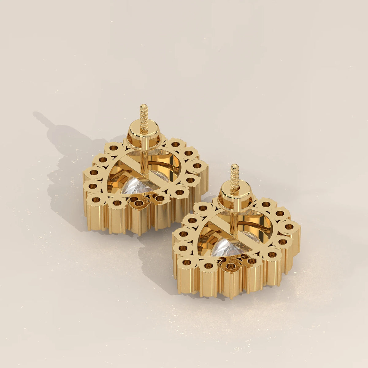 Pear Lab Grown Diamond Studs in a Raised Cup Halo with Milgrain in yellow gold, product photograph on a plain background.