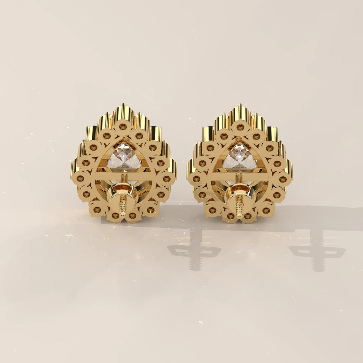 Pear Lab Grown Diamond Studs in a Raised Cup Halo with Milgrain in yellow gold, shown on a plain background.