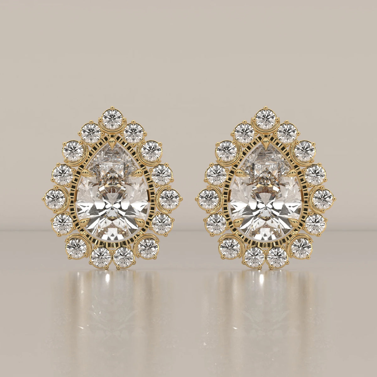 Pear Lab Grown Diamond Studs in a Raised Cup Halo with Milgrain in yellow gold, shown from the front.