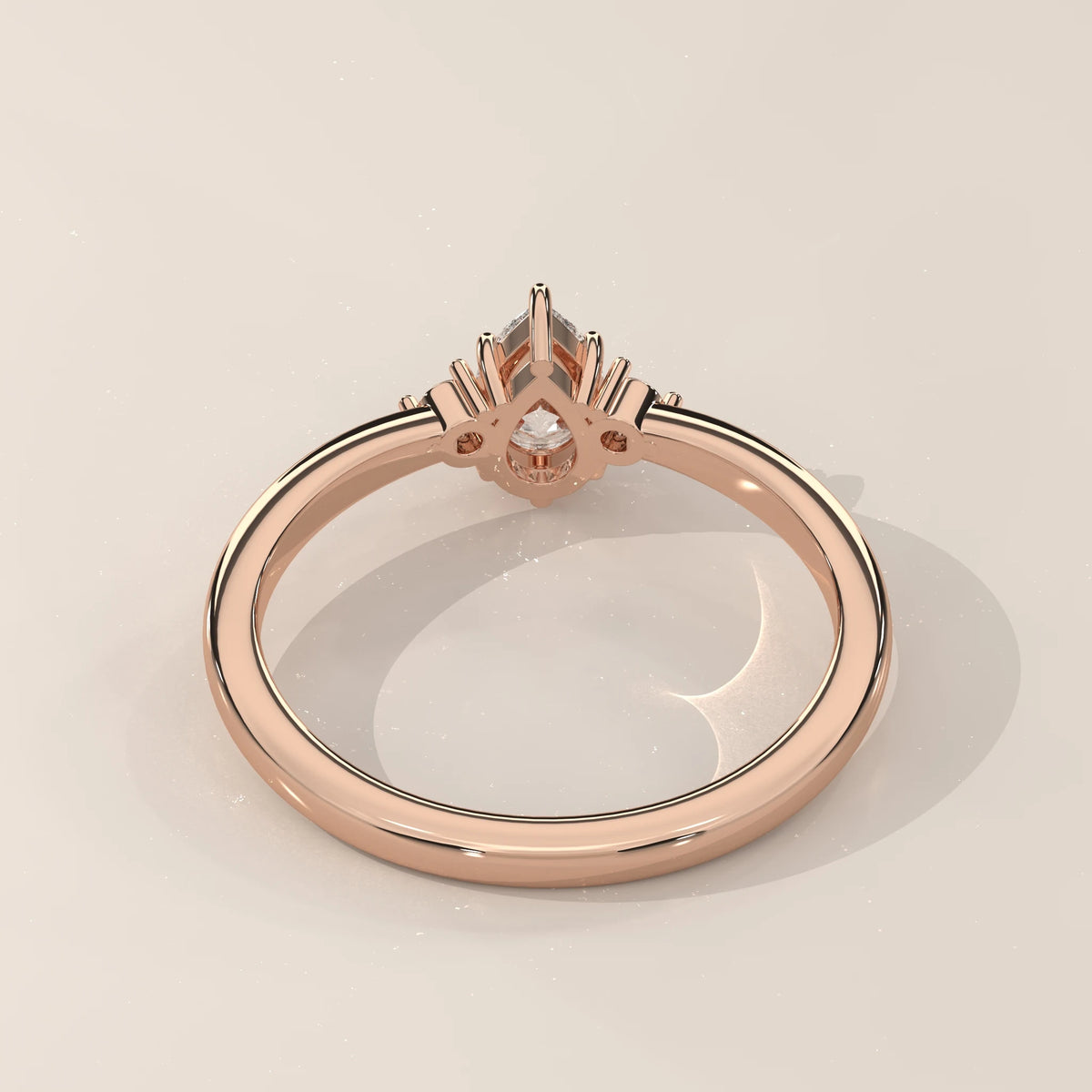 Back view of pear lab grown diamond engagement ring in 14k rose gold