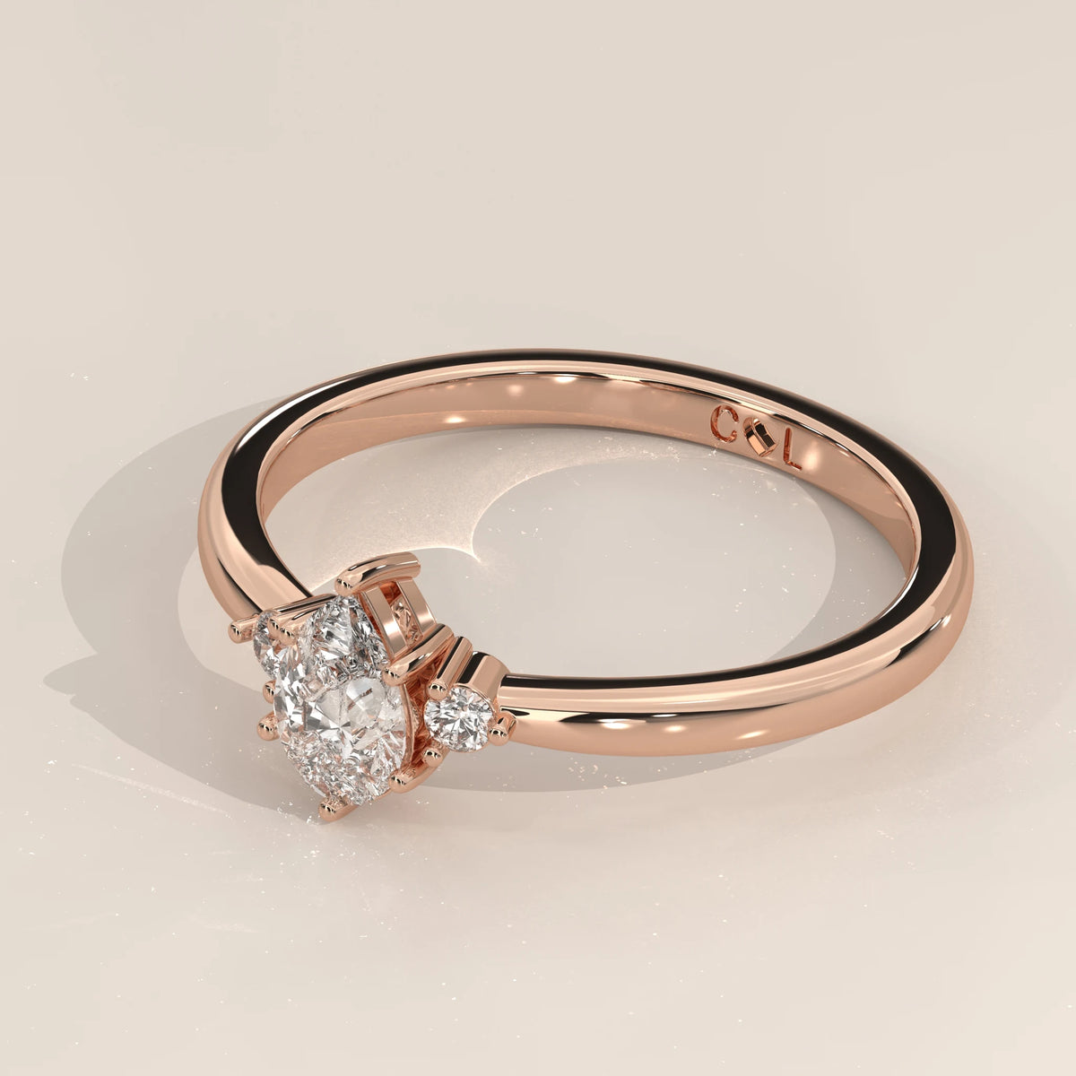 Pear cut lab grown diamond ring in 14k rose gold, side angle view