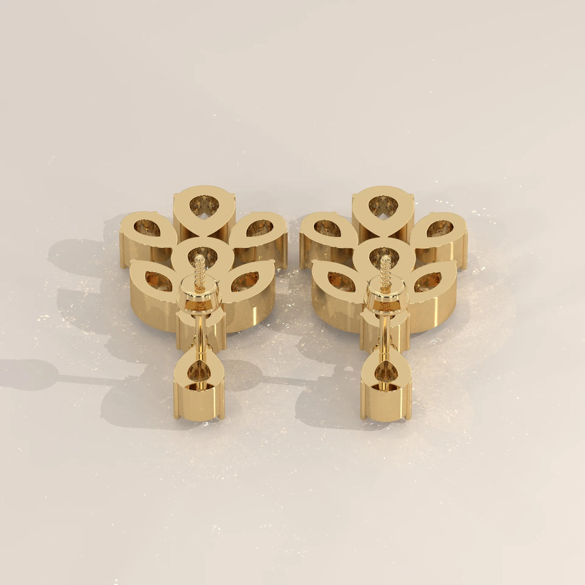 Pear and Marquise Lab Grown Diamond Leaf Cluster Drop Earrings in yellow gold, studio photograph on a plain background.