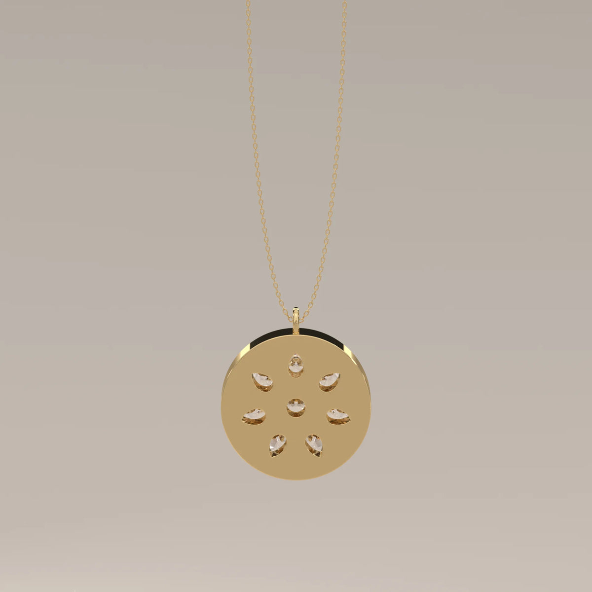 Pear Petal Lab Grown Diamond Flower Set in a Gold Disc Medallion in yellow gold, shown on a plain background.