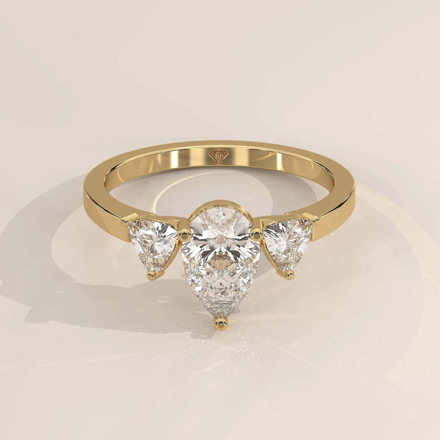 Three-Quarter View: Pear Diamond Engagement Ring with Three-Stone Setting in Yellow Gold – Lab Grown – Driona Jewels