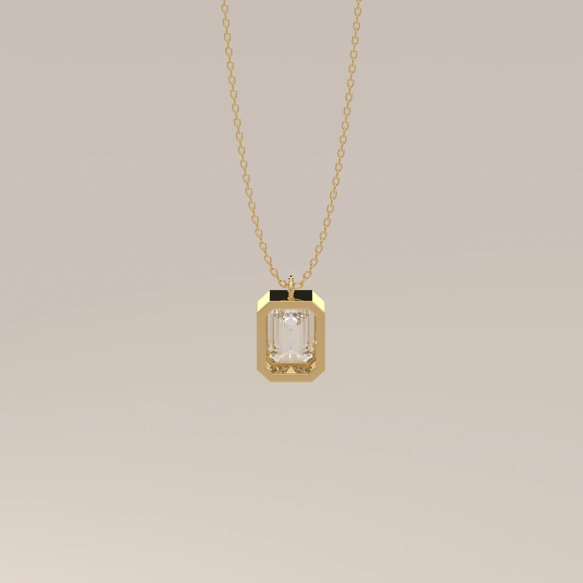 A yellow gold necklace featuring an emerald-cut diamond pendant.