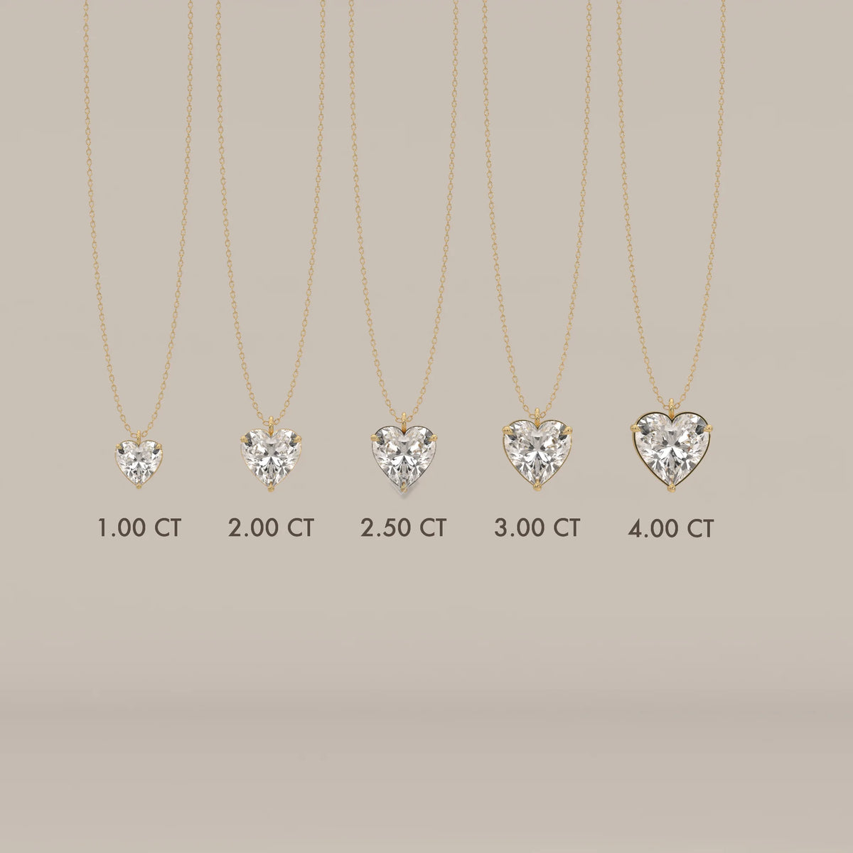 A collection of heart-shaped diamond pendants in yellow gold, shown in different sizes.