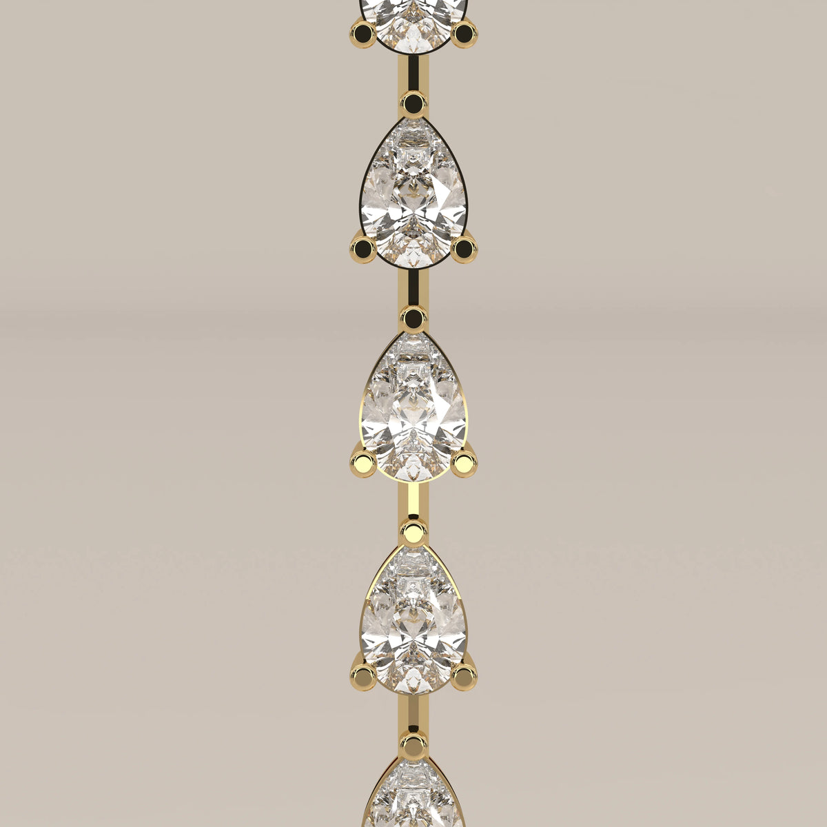 A pear shape lab grown diamond drop necklace in yellow gold, product photograph on a plain background.